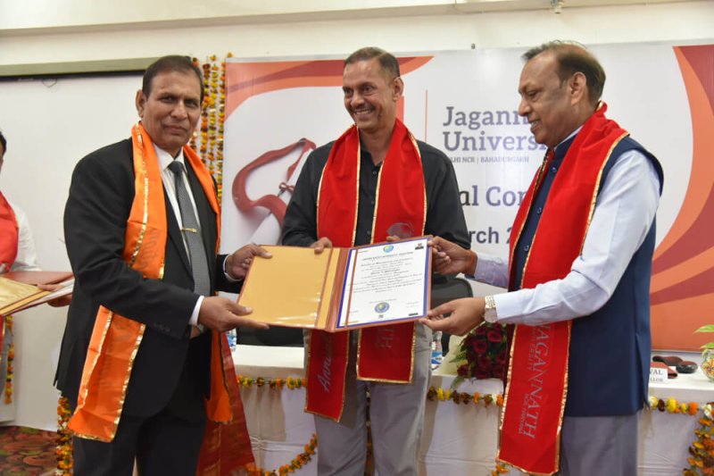 Dr. K . R. Madhar receiving his Doctorate Degree.