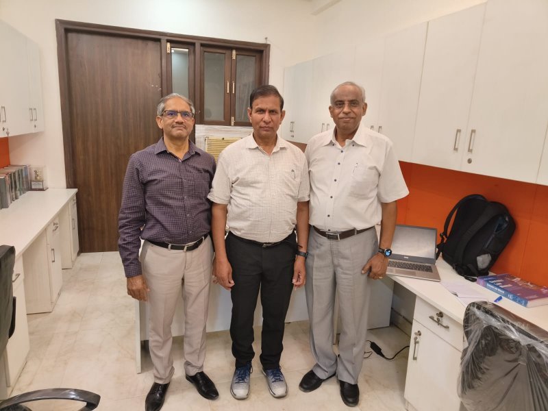 Dr. K. R. Madhar with his colleagues at his office. 
